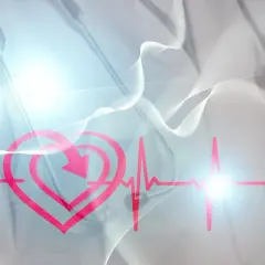 Serce z rytmem EKG i strzałką symbolizującą regulację, sugerujące monitorowanie poziomu wapnia we krwi.