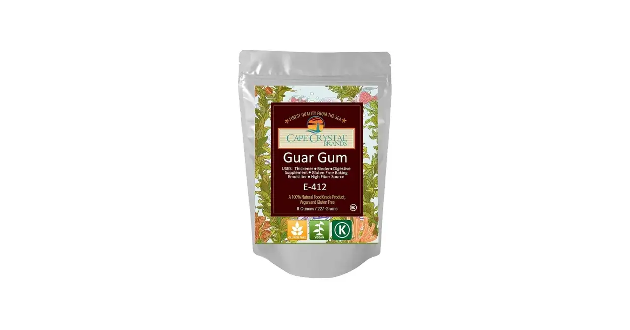 Opakowanie gumy guar marki Cape Crystal Brands, z opisem zastosowań: zagęstnik, stabilizator, suplement diety, do wypieków bezglutenowych.