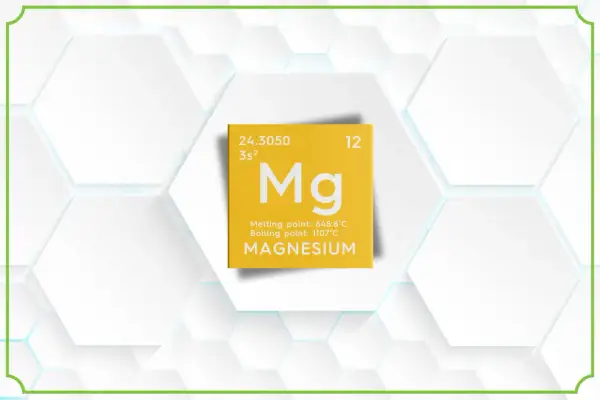 Żółta tabliczka z symbolem Mg, informacją o magnezie i jego temperaturach topnienia/wrzenia. Treonian magnezu lek.